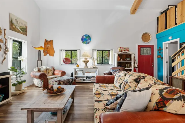 a living room with furniture window and a flat screen tv