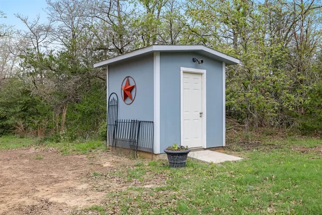 a house with trees in the background