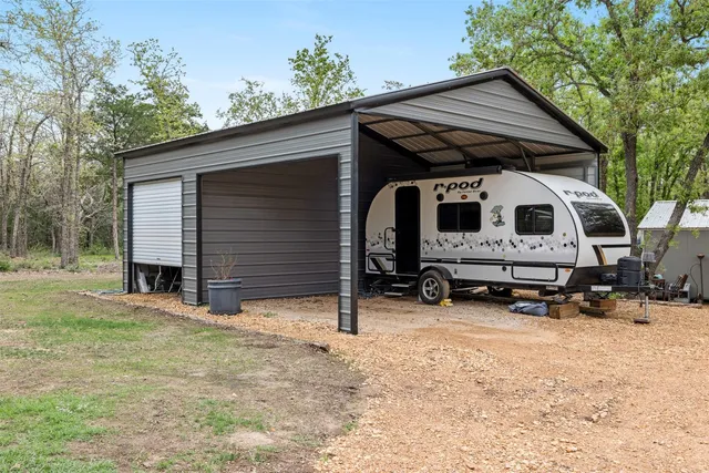 a view of backyard with cabin