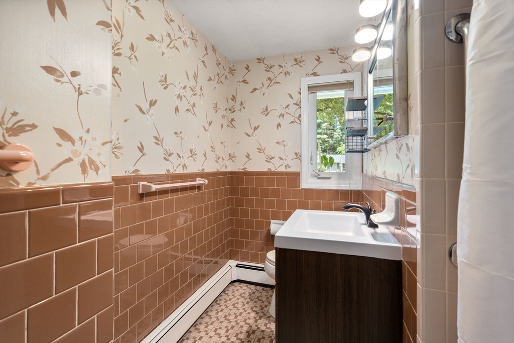 14 Corrine Drive Framingham, MA 01701 - Photo 11 of 15 a bathroom with a sink and a shower