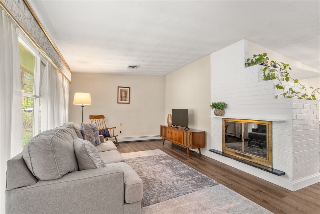 14 Corrine Drive Framingham, MA 01701 - Photo 3 of 15 a living room with furniture and a fireplace
