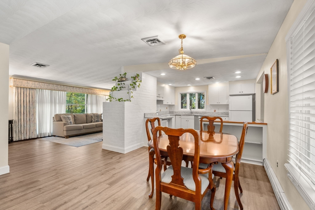 14 Corrine Drive Framingham, MA 01701 - Photo 5 of 15 a view of a dining room with furniture and wooden floor