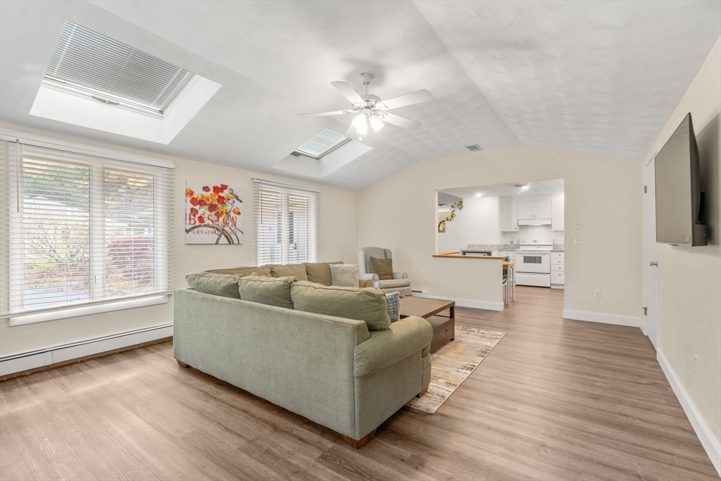 14 Corrine Drive Framingham, MA 01701 - Photo 9 of 15 a living room with furniture and a flat screen tv