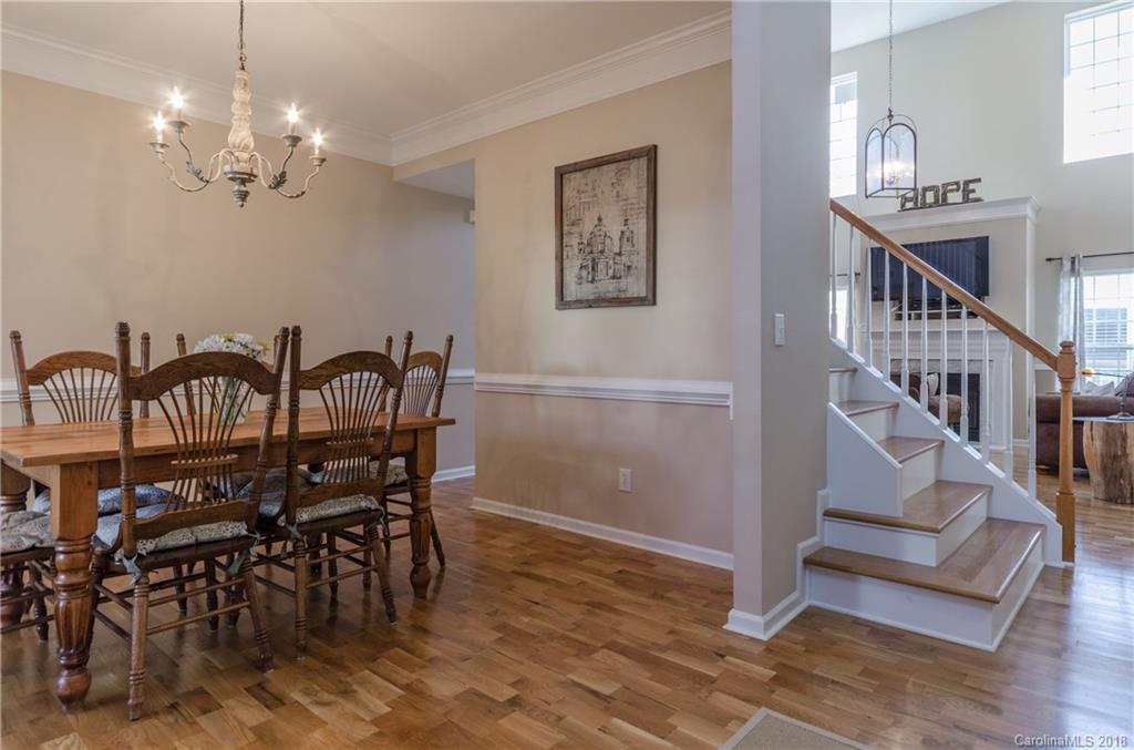 4100 Desert Rose Court Fort Mill, SC 29708 - Photo 4 of 33 a view of a dining room with furniture and chandelier