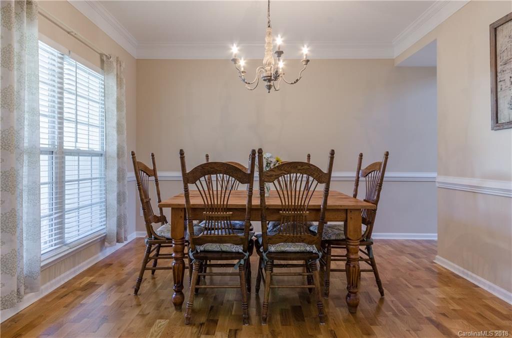 4100 Desert Rose Court Fort Mill, SC 29708 - Photo 5 of 33 a view of a dining room with furniture wooden floor and chandelier