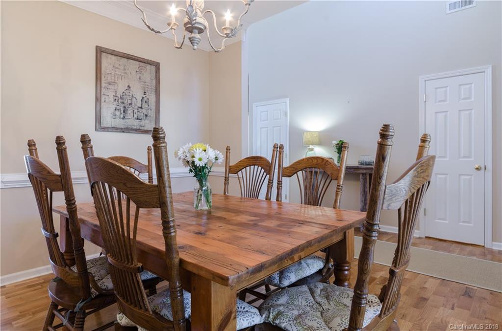 4100 Desert Rose Court Fort Mill, SC 29708 - Photo 8 of 33 a view of a dining room with furniture and chandelier