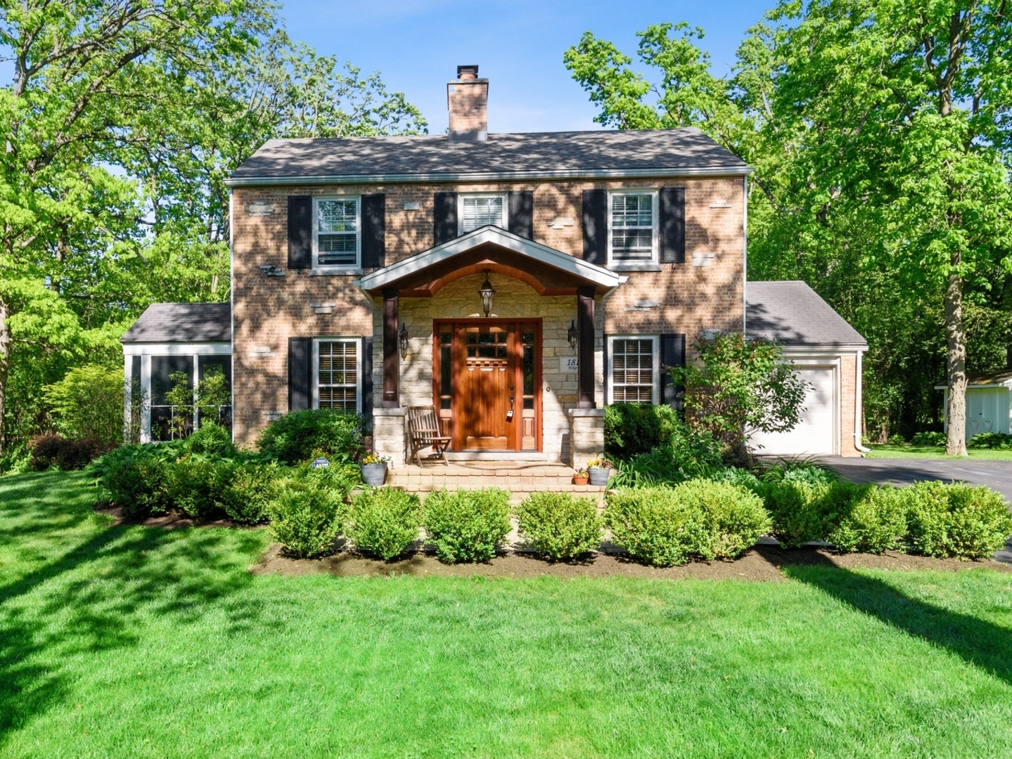 181 Ridge Road Highland Park, IL 60035 - Photo 2 of 16 a front view of a house with garden
