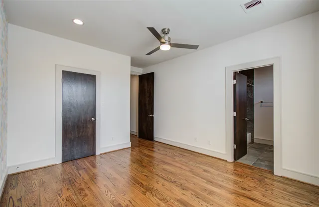 a bathroom with a bathtub and a toilet