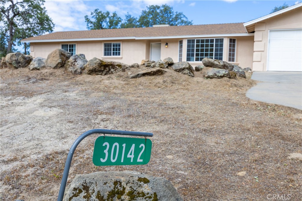 30142 Revis Road Coarsegold, CA 93614 - Photo 36 of 43 a view of two couches in front of a house