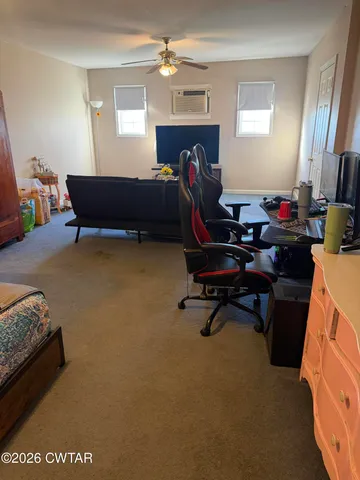 a view of a workspace with furniture and a livingroom