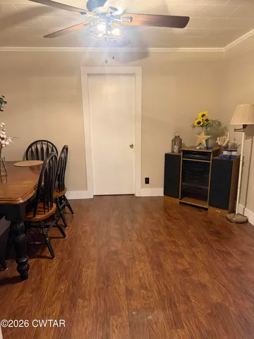 a view of workspace with furniture and wooden floor
