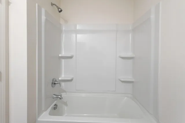 a close view of a bathtub in bathroom