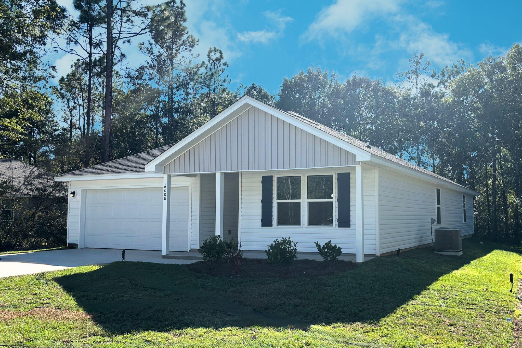 6008 Hidden Knoll Crestview, FL 32539 - Photo 3 of 28 a view of a white house with a yard