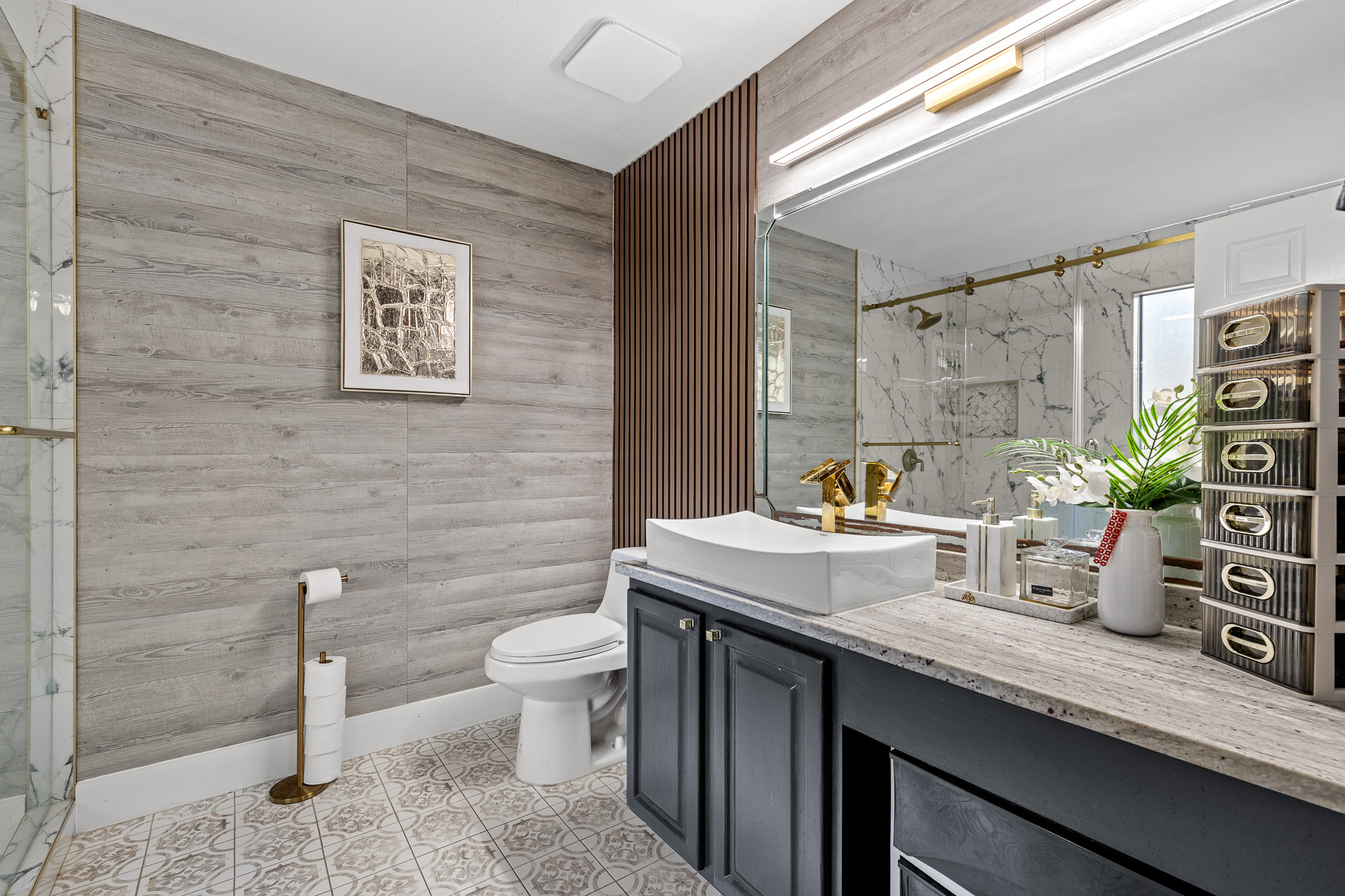 615 Barbara Way Bastrop, TX 78602 - Photo 13 of 27 a bathroom with a granite countertop toilet sink and mirror