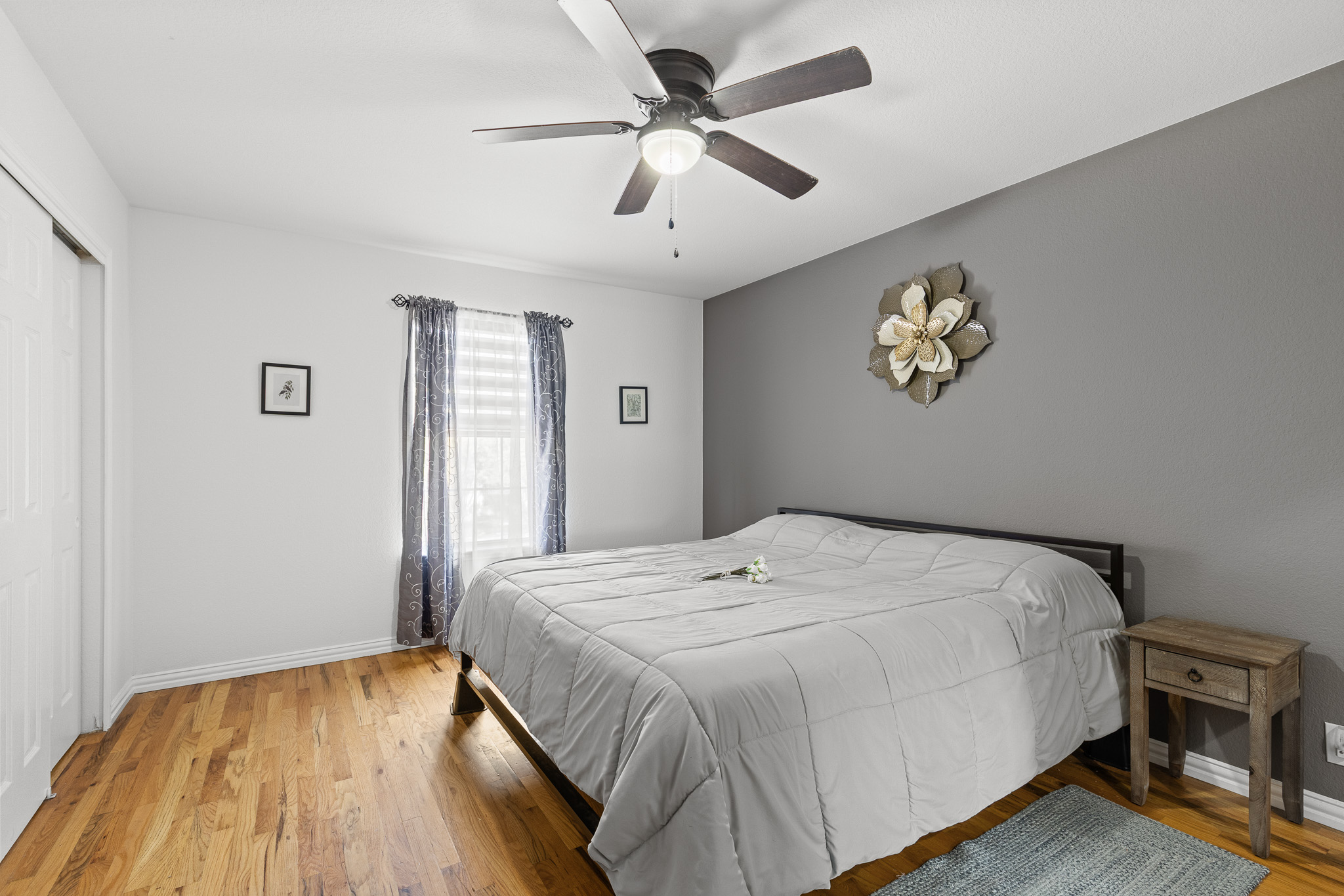 615 Barbara Way Bastrop, TX 78602 - Photo 18 of 27 a bedroom with a bed and a chandelier