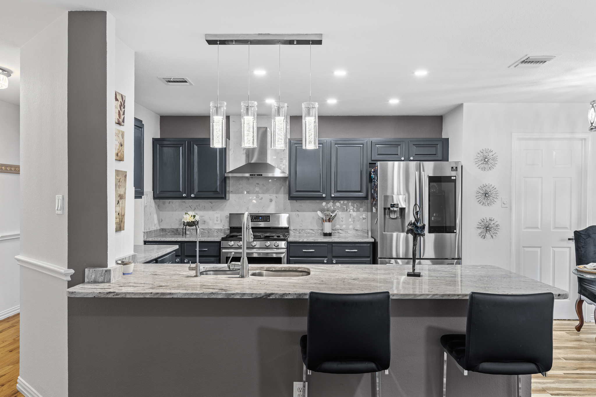 615 Barbara Way Bastrop, TX 78602 - Photo 2 of 27 a kitchen with stainless steel appliances granite countertop a sink and cabinets
