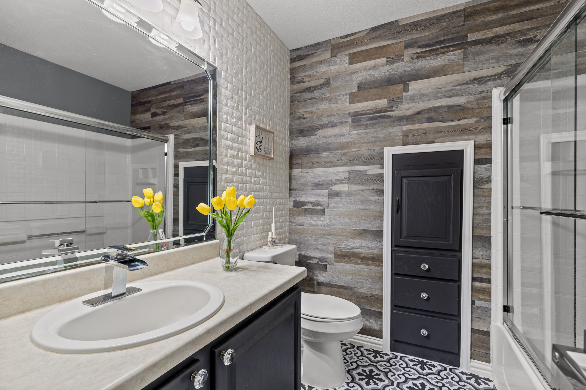 615 Barbara Way Bastrop, TX 78602 - Photo 22 of 27 a bathroom with a sink a toilet and mirror