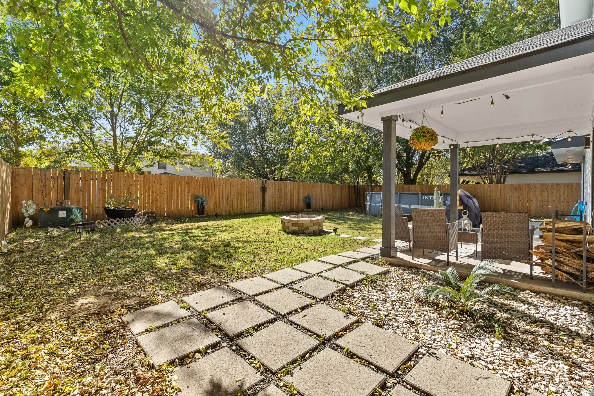 615 Barbara Way Bastrop, TX 78602 - Photo 24 of 27 a view of a backyard with large tree and wooden fence