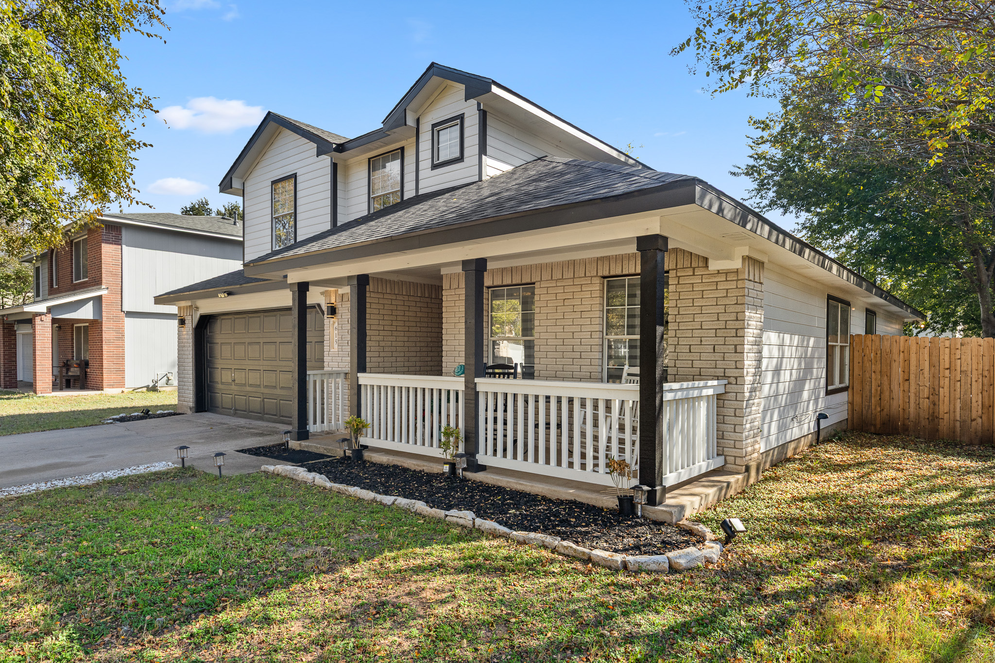 615 Barbara Way Bastrop, TX 78602 - Photo 3 of 27 a front view of a house with a yard