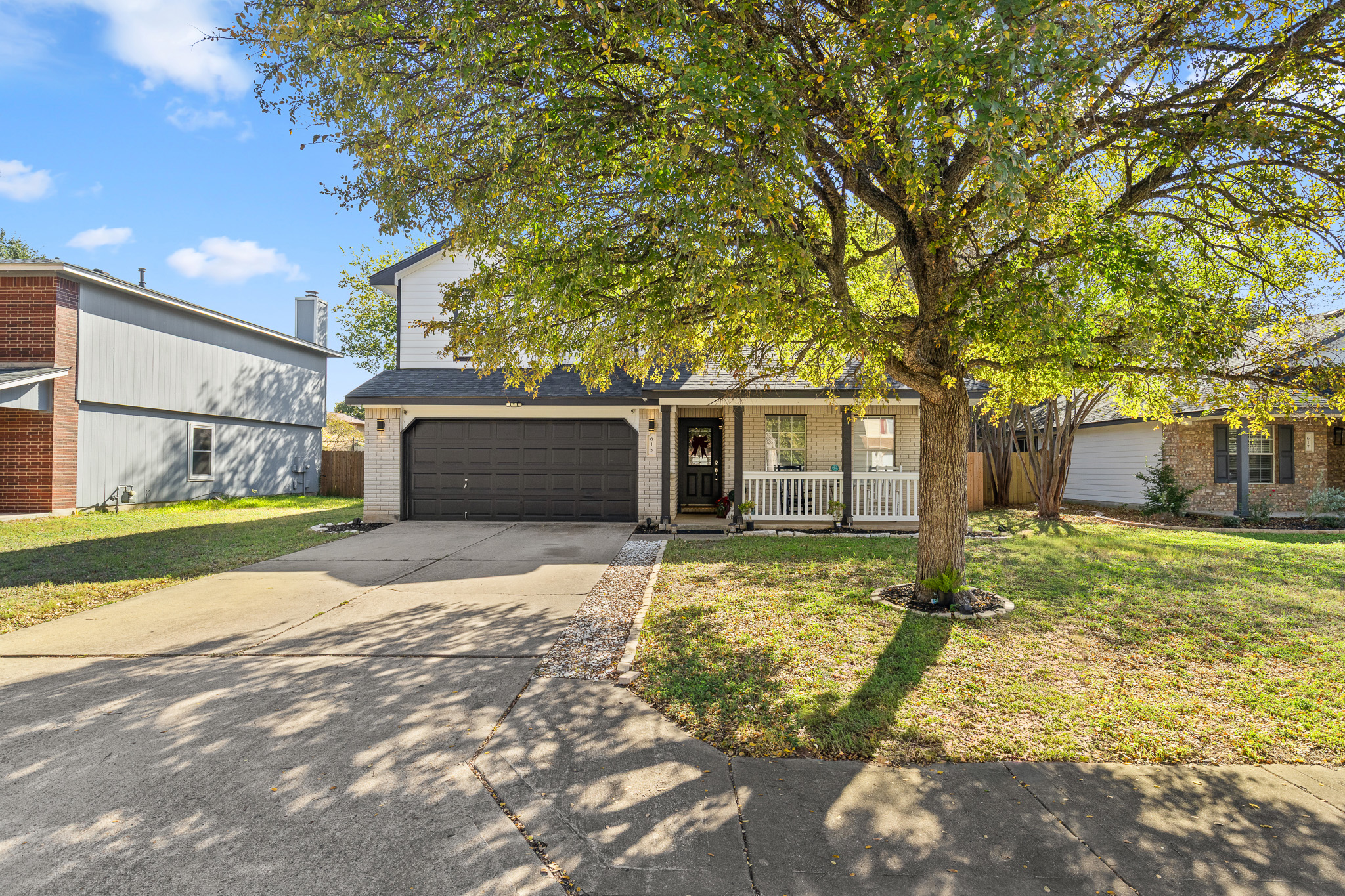 615 Barbara Way Bastrop, TX 78602 - Photo 4 of 27 a view of a house with a yard and large tree