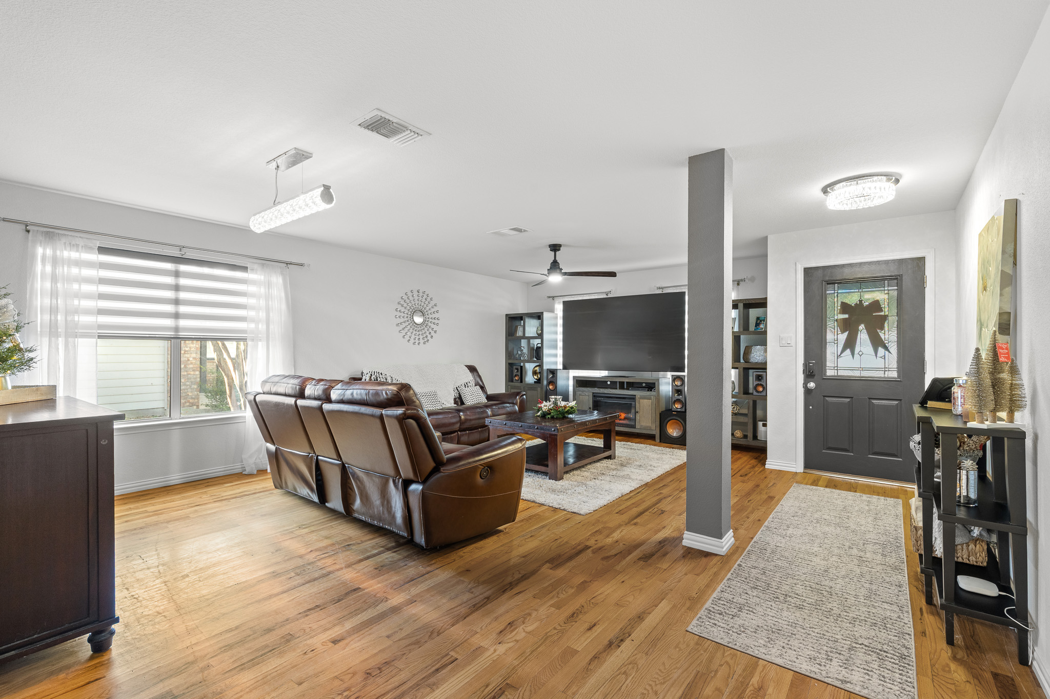 615 Barbara Way Bastrop, TX 78602 - Photo 4 of 27 a living room with furniture and a flat screen tv