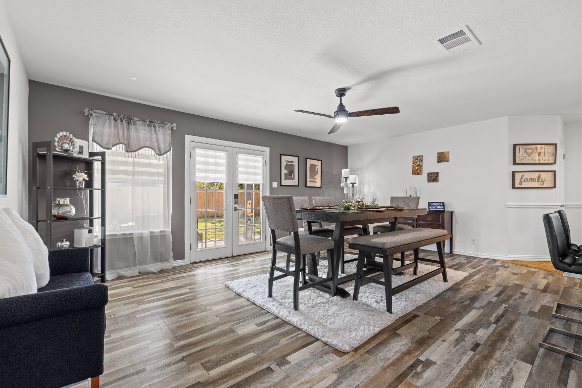 615 Barbara Way Bastrop, TX 78602 - Photo 10 of 27 Dining space featuring light wood-style flooring, ceiling fan, and french doors