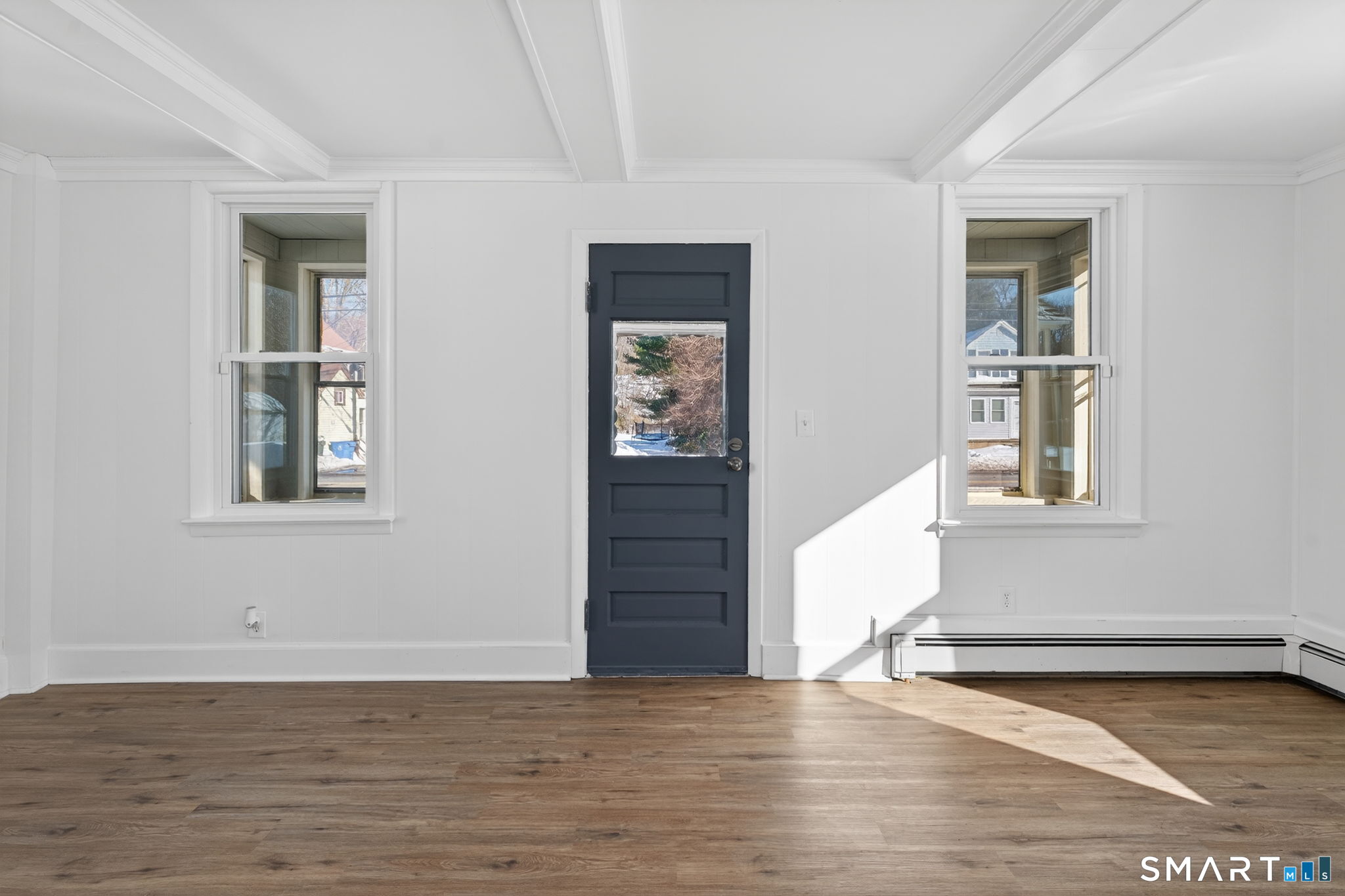 119 Taftville-Occum Road Norwich, CT 06360 - Photo 13 of 27 a view of an empty room with window and wooden floor