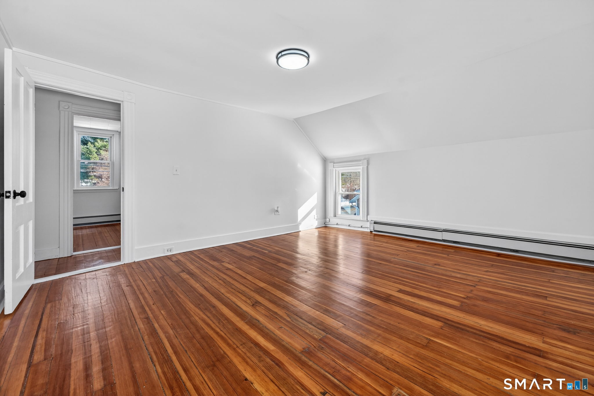 119 Taftville-Occum Road Norwich, CT 06360 - Photo 17 of 27 a view of empty room with wooden floor and fan