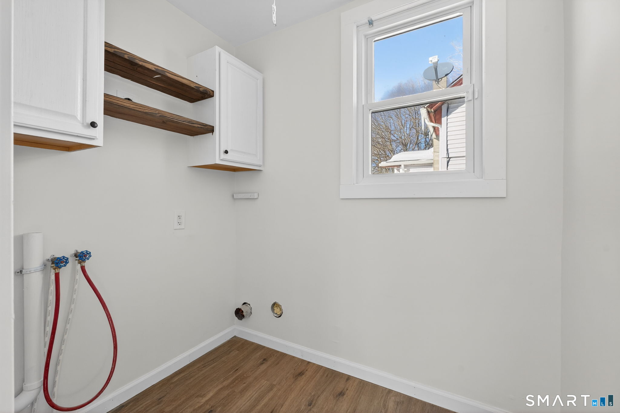 119 Taftville-Occum Road Norwich, CT 06360 - Photo 8 of 27 a view of a hallway with wooden floor and entryway