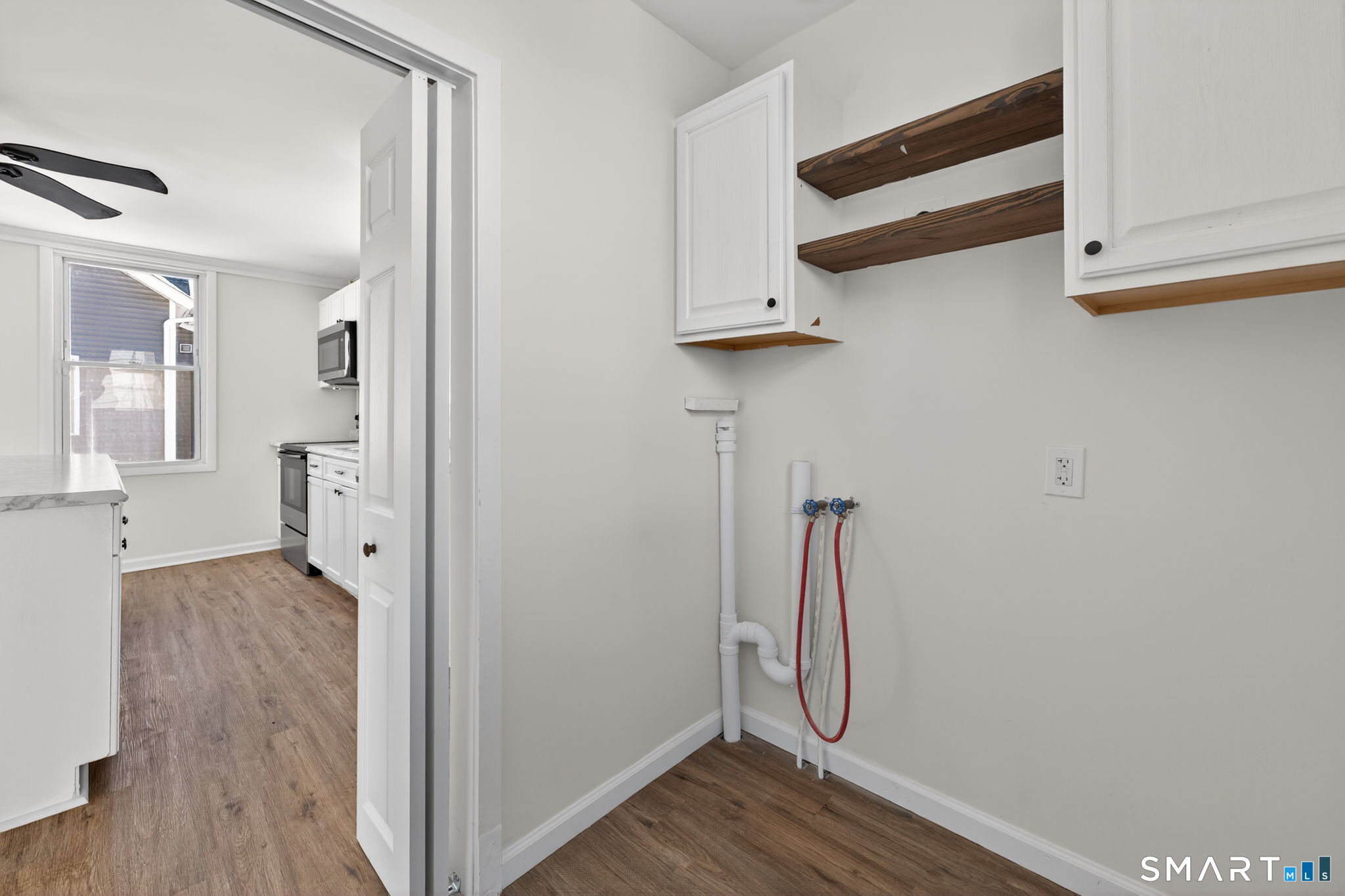 119 Taftville-Occum Road Norwich, CT 06360 - Photo 9 of 27 a view of room with wooden floor