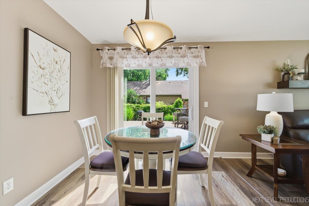 10 Shermead Road Montgomery, IL 60538 - Photo 9 of 30 a dining room with furniture and wooden floor