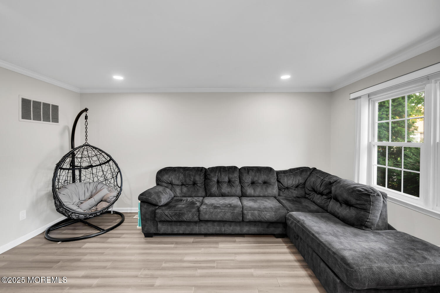 3 Lisa Drive Hazlet, NJ 07730 - Photo 6 of 30 a living room with furniture a window and gym equipment