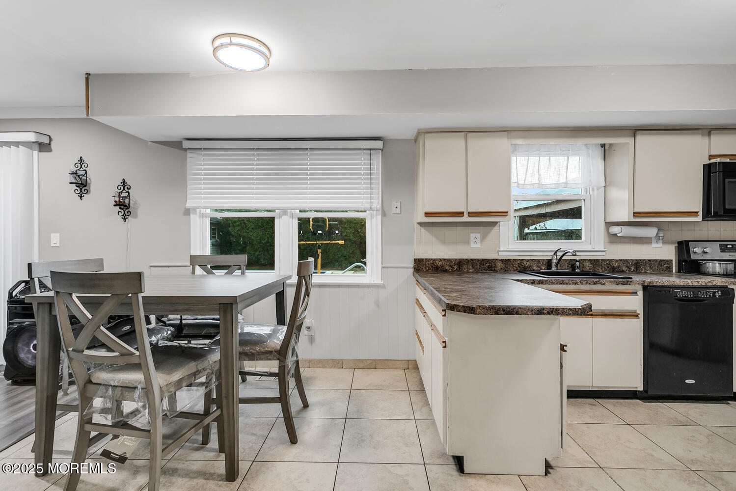 3 Lisa Drive Hazlet, NJ 07730 - Photo 9 of 30 a kitchen with granite countertop a table chairs sink and cabinets