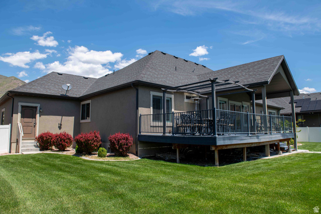 646 East 1400th Street North Mapleton, UT 84664 - Photo 67 of 78 Elevated rear deck with dark composite decking, black metal railings, and a partial pergola