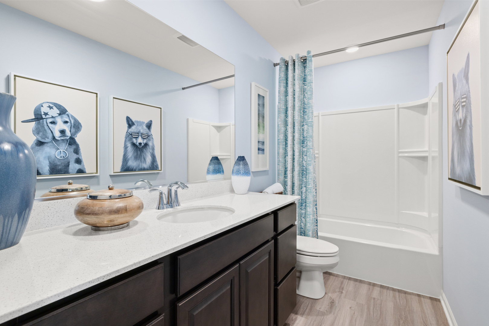 557 Wolverine Drive Aurora, IL 60502 - Photo 27 of 30 a bathroom with a sink a toilet and shower