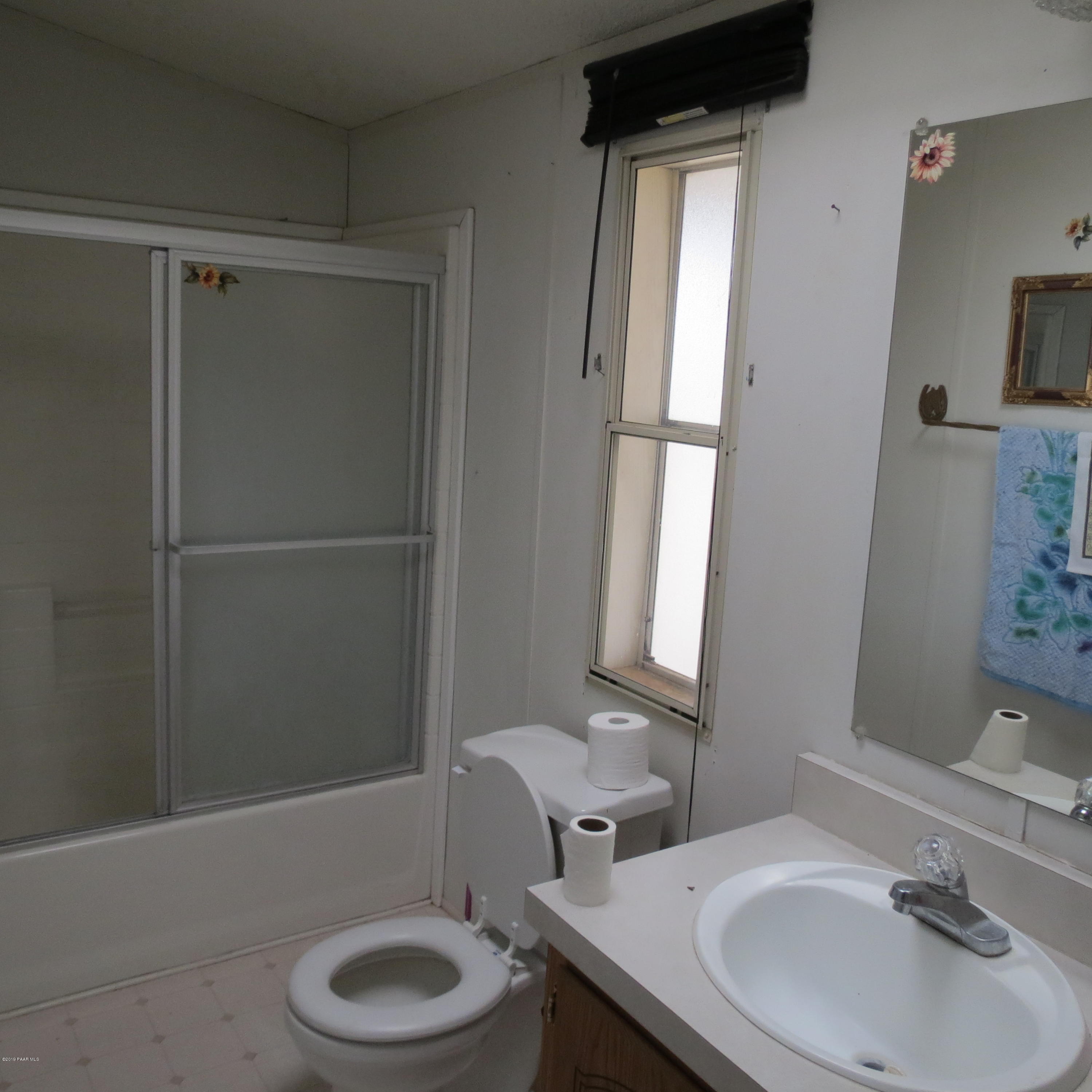 1400 Saddle Road Paulden, AZ 86334 - Photo 13 of 28 a bathroom with a sink toilet and shower