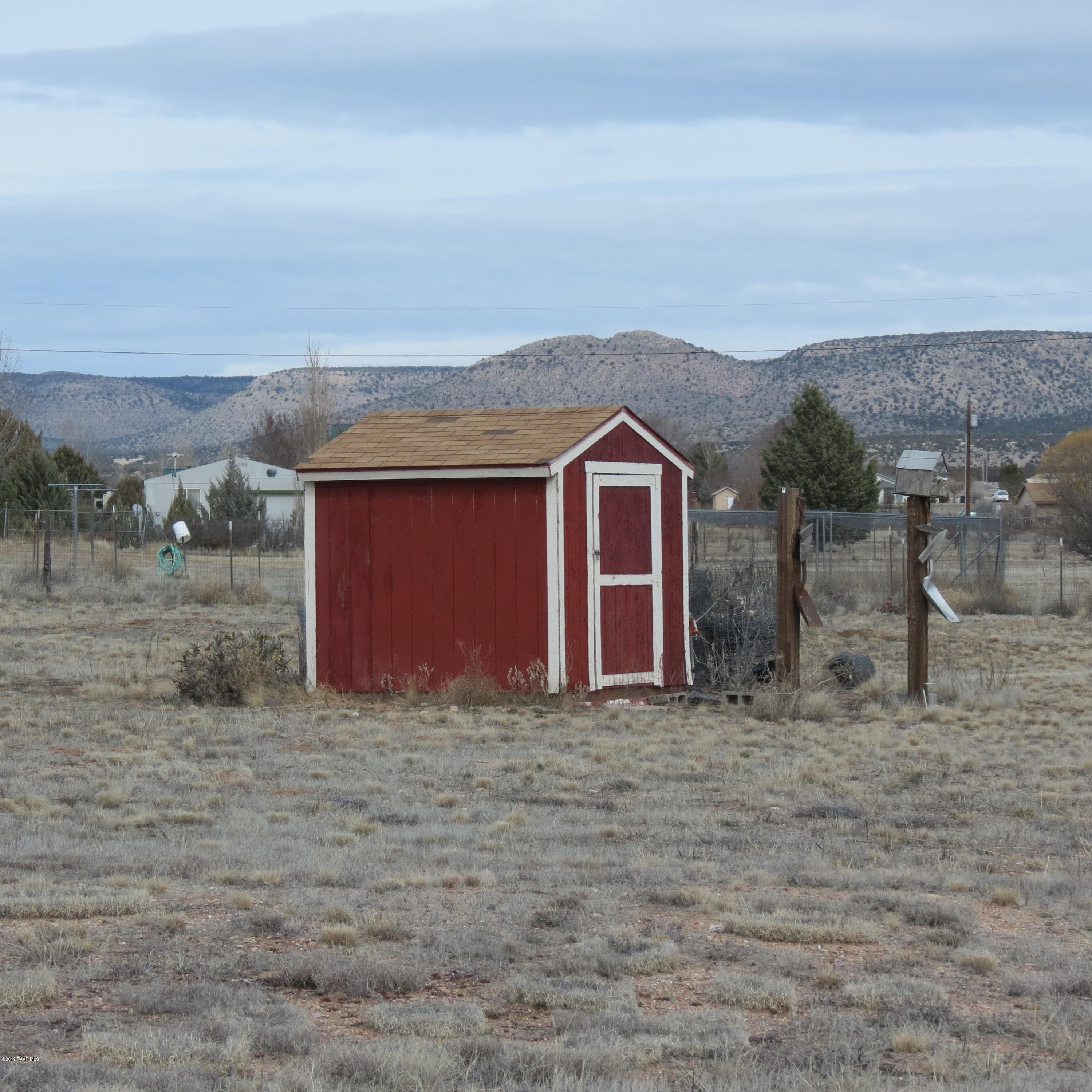 1400 Saddle Road Paulden, AZ 86334 - Photo 26 of 28 a view of a house with a yard