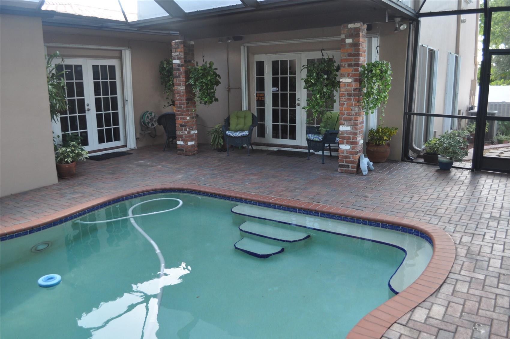 2175 Northeast 185th Street Miami, FL 33180 - Photo 31 of 32 Screened in heated waterfall pool