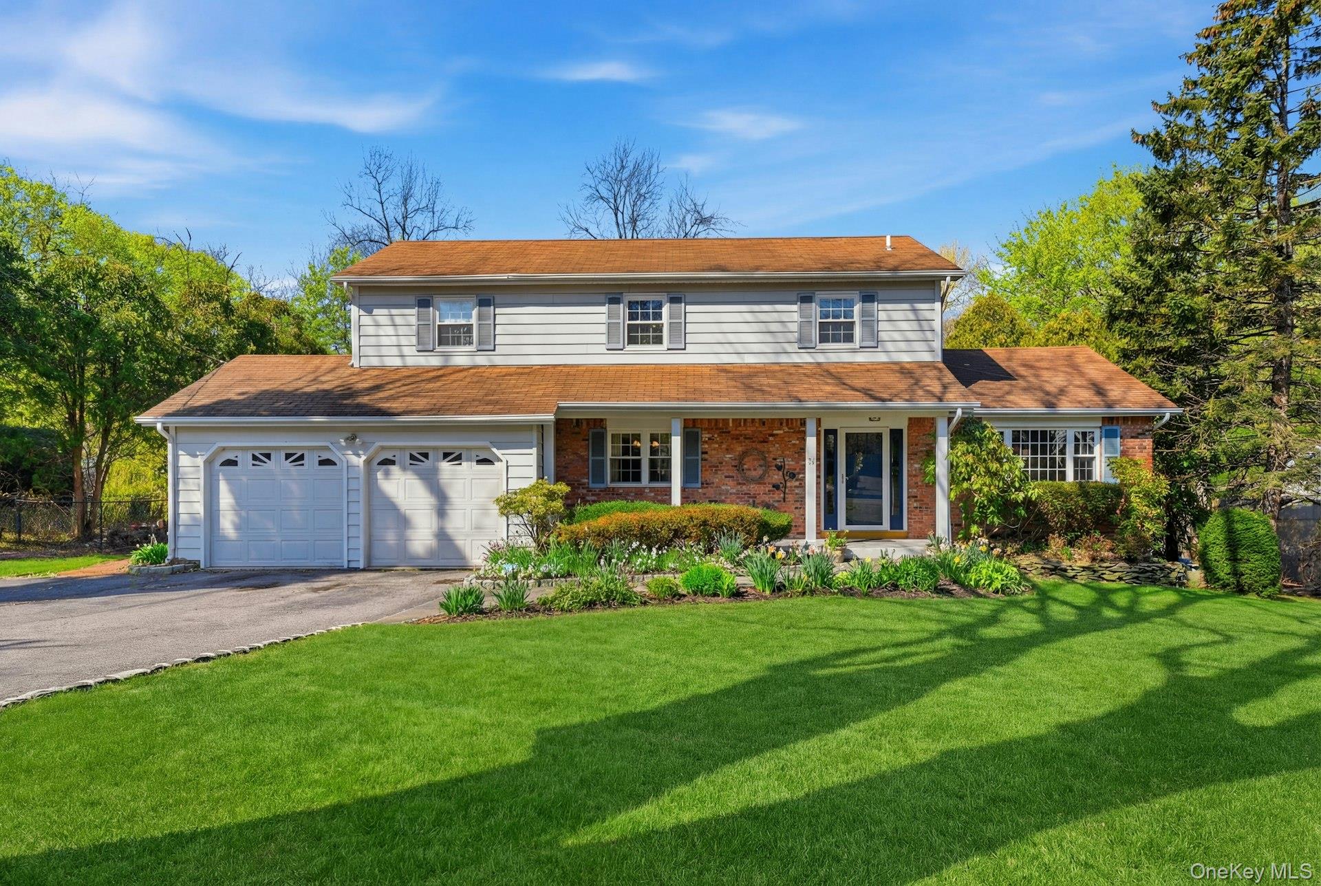 35 East Neck Road Huntington, NY 11743 - Photo 1 of 41 a front view of a house with a yard