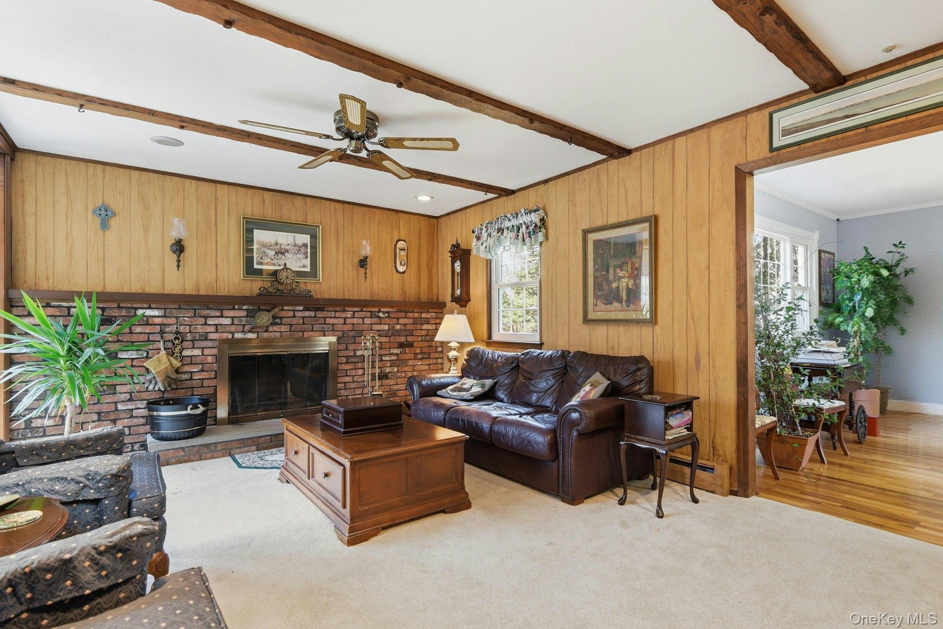 35 East Neck Road Huntington, NY 11743 - Photo 11 of 41 a living room with furniture and a fireplace