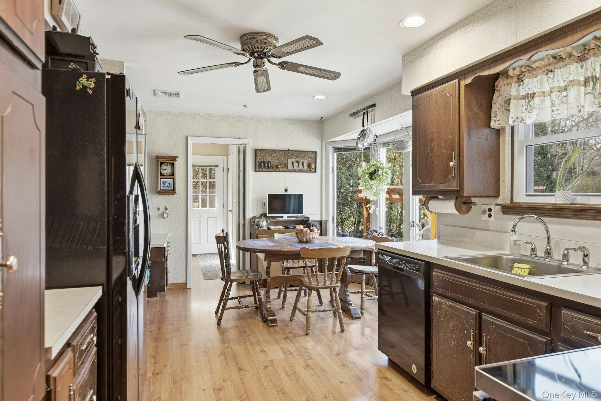 35 East Neck Road Huntington, NY 11743 - Photo 12 of 41 a view of a dining room with furniture window and wooden floor