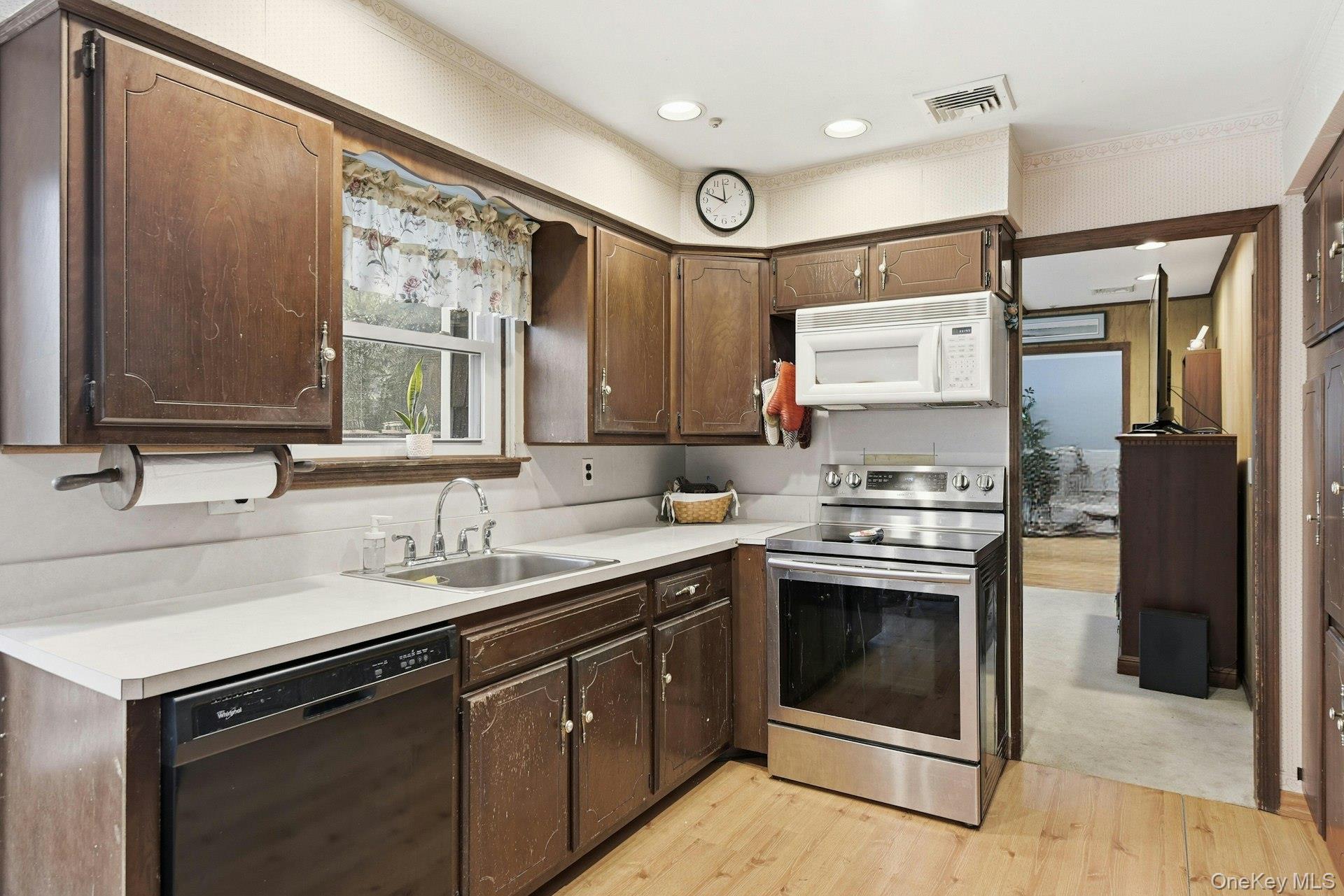 35 East Neck Road Huntington, NY 11743 - Photo 13 of 41 a kitchen with stainless steel appliances granite countertop a sink stove and refrigerator