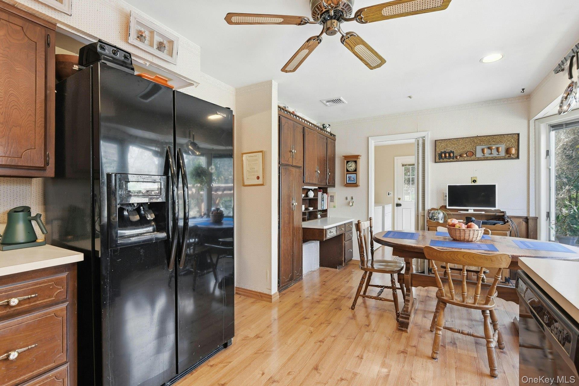 35 East Neck Road Huntington, NY 11743 - Photo 15 of 41 a view of a dining room with furniture window and wooden floor