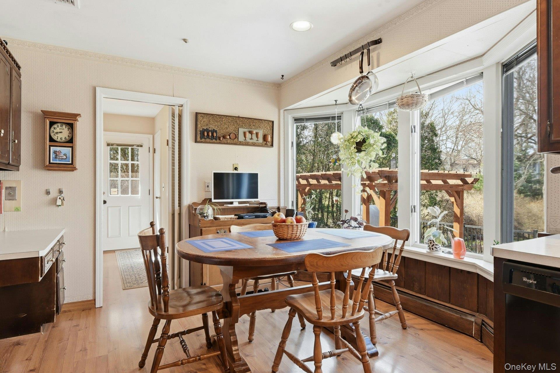 35 East Neck Road Huntington, NY 11743 - Photo 16 of 41 a view of a dining room with furniture window and wooden floor