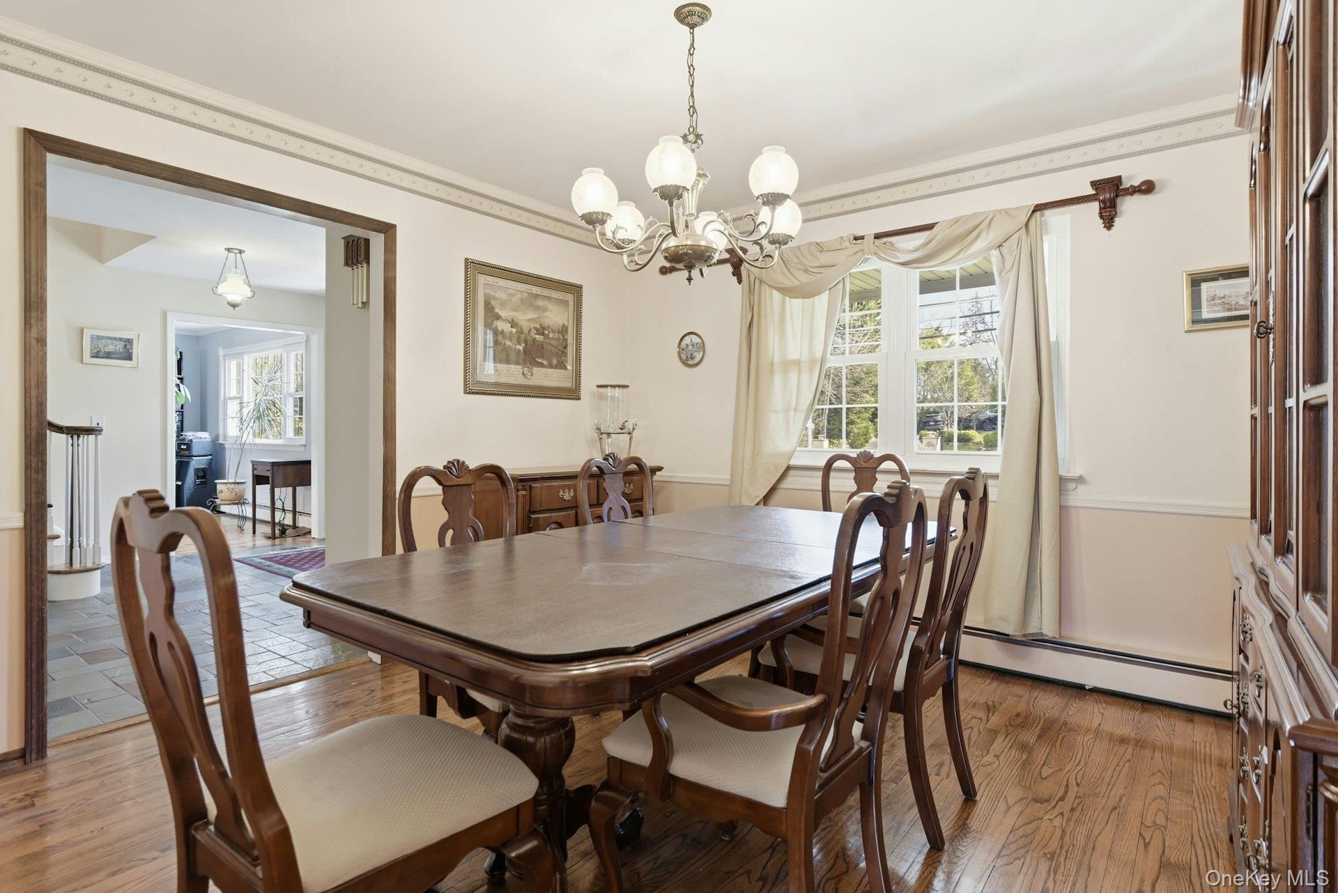 35 East Neck Road Huntington, NY 11743 - Photo 18 of 41 a view of a a dining room with furniture window and wooden floor