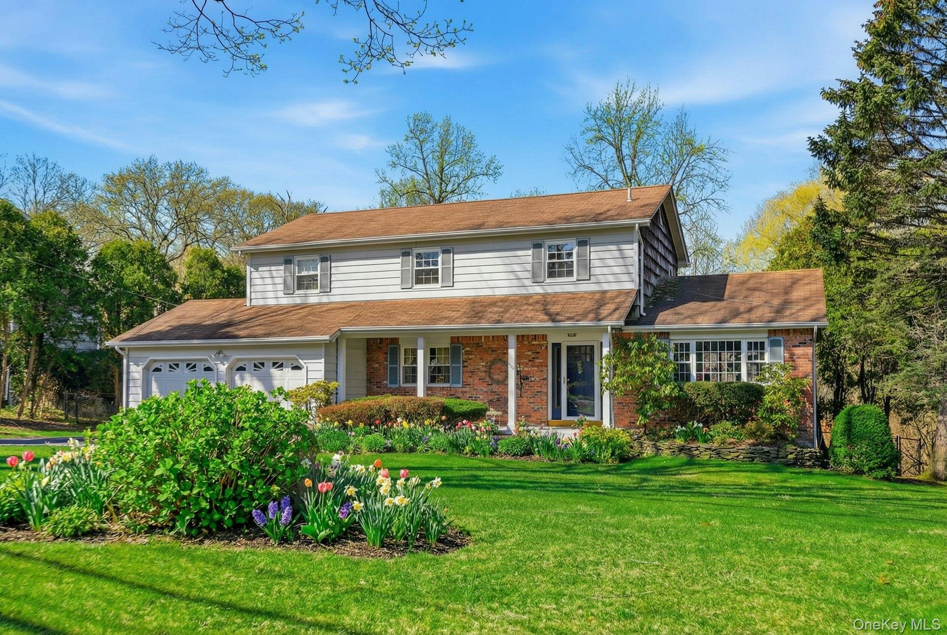 35 East Neck Road Huntington, NY 11743 - Photo 2 of 41 a view of a house with a yard and potted plants