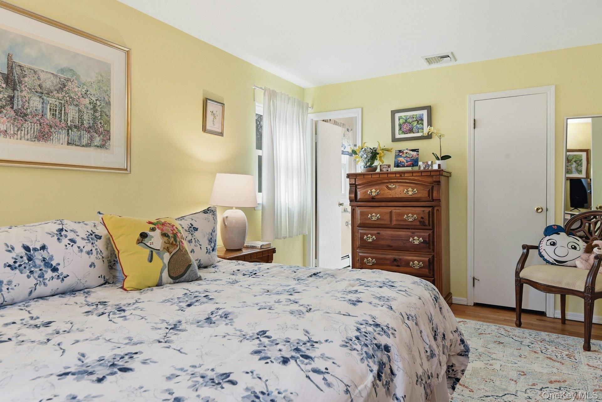 35 East Neck Road Huntington, NY 11743 - Photo 21 of 41 a bedroom with a bed and furniture