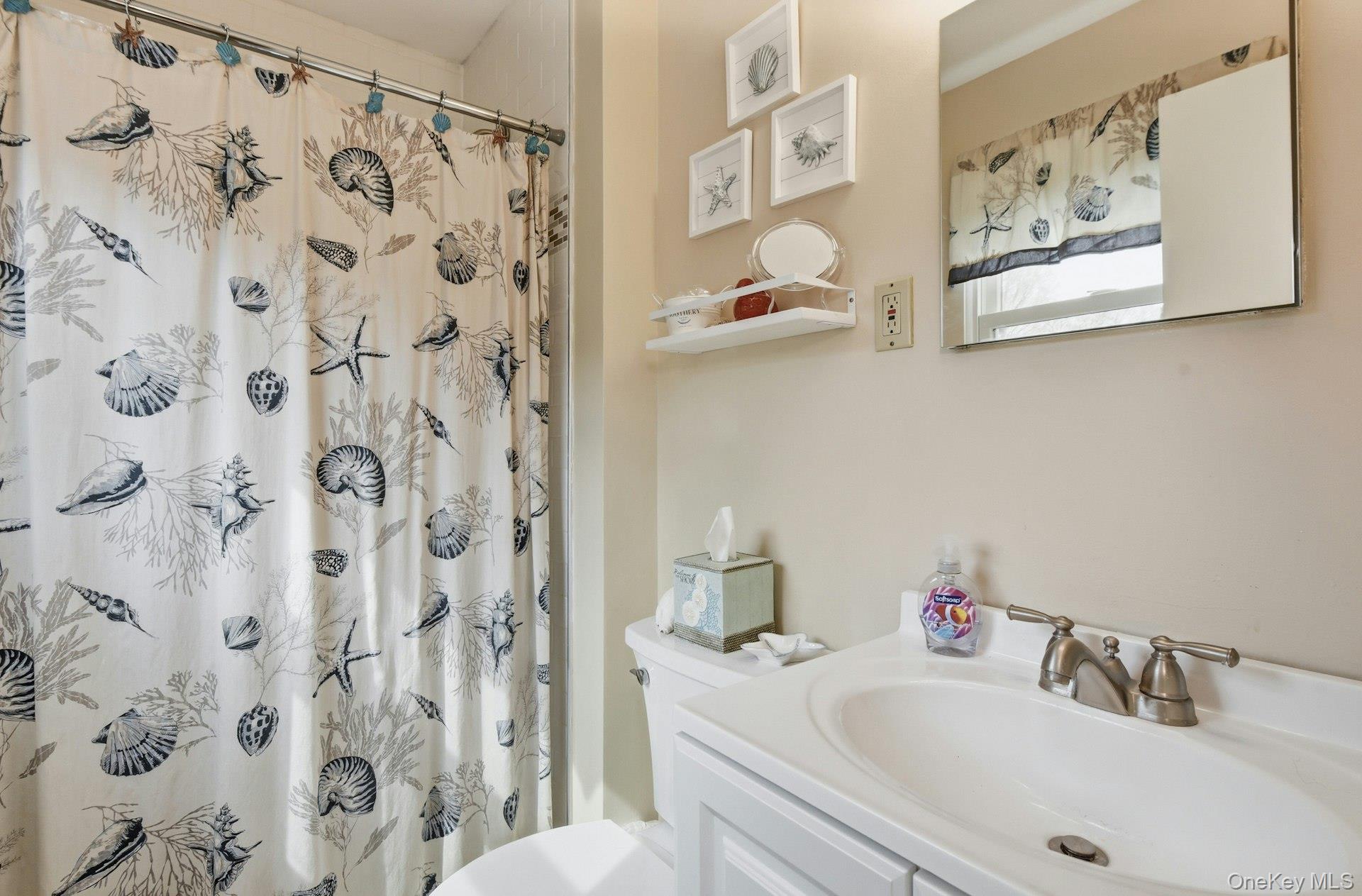 35 East Neck Road Huntington, NY 11743 - Photo 22 of 41 a bathroom with a sink and a toilet