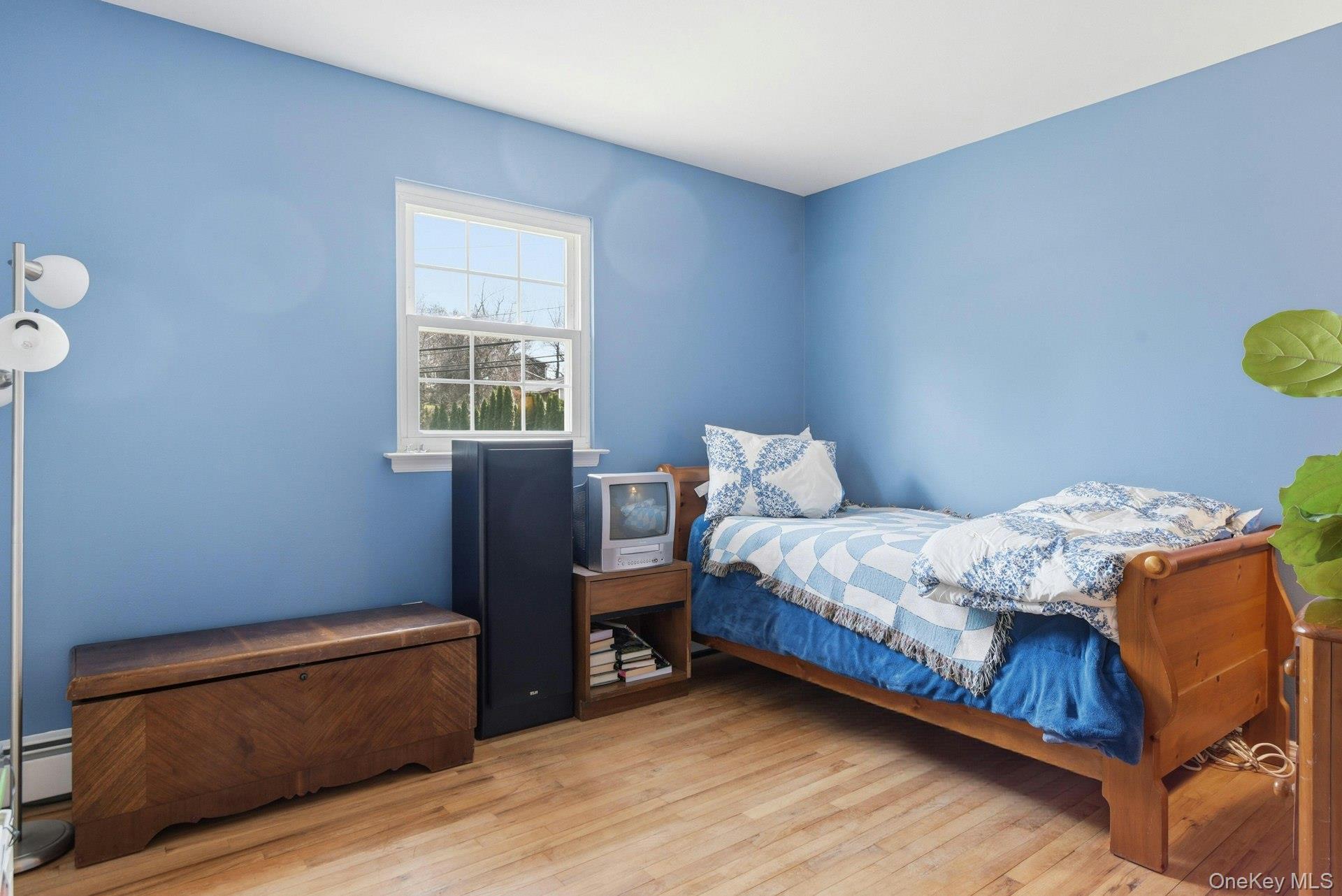 35 East Neck Road Huntington, NY 11743 - Photo 24 of 41 a bedroom with a bed and a window