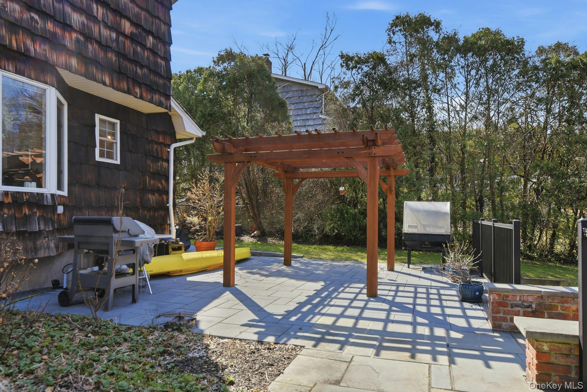 35 East Neck Road Huntington, NY 11743 - Photo 29 of 41 a view of a swimming pool with a patio